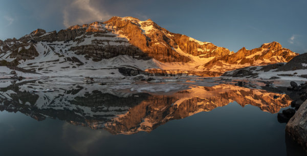 Alpenglow glacial lake reflection